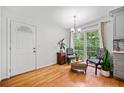 Bright kitchen area with hardwood floors, a view to the outside and stylish decor at 1448 Drayton Woods Dr, Tucker, GA 30084