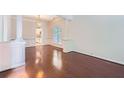 Elegant dining area featuring hardwood floors, white wainscoting, and modern chandelier at 1259 Crescentwood Ln, Decatur, GA 30032