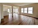 Living room with hardwood floors and a view of the kitchen and backyard at 1956 Asher Ln # 51, Conyers, GA 30013