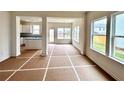 Bright living area featuring a kitchen view and large windows at 1956 Asher Ln # 51, Conyers, GA 30013