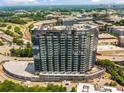 Luxury condo building with sleek design, multiple balconies, and an attached parking garage at 788 W Marietta Nw St # 905, Atlanta, GA 30318