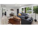 Cozy living room featuring a modern sofa, sleek decor, and natural light at 1959 Oana Sw St, Atlanta, GA 30310