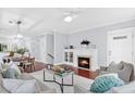 Bright living area features a fireplace, an open floor plan and hardwood floors at 655 Mead Se St # 79, Atlanta, GA 30312