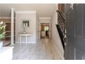 Inviting foyer with marble floors, staircase, and views into the kitchen, creating an open and welcoming space at 988 Gentry Sw Ln, Marietta, GA 30064