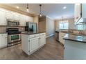 Well-equipped kitchen with stainless steel appliances, granite countertops, and a center island at 988 Gentry Sw Ln, Marietta, GA 30064