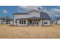 Rear exterior showcasing a covered patio and large backyard at 180 Paislee Park (Lot #9 Paislee Park) Dr, Fayetteville, GA 30215