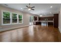 Open-concept living space with hardwood floors and lots of windows for natural light at 4900 Kentwood Dr, Marietta, GA 30068
