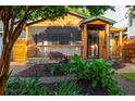 Inviting home showcases a charming porch, complemented by a lush garden and a brick path leading to the entrance at 625 Kennesaw Ave, Atlanta, GA 30308