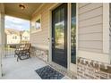 Inviting front porch features brick accents and seating, perfect for relaxing outdoors at 2080 Abbey Rd, Roswell, GA 30076