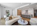 Open-concept living space with kitchen, dining, and living areas featuring hardwood floors at 2425 Peachtree Rd # 508, Atlanta, GA 30305