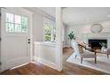 Bright living room with hardwood floors, a fireplace, and plenty of natural light at 509 Ponce De Leon Pl, Decatur, GA 30030