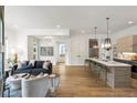 Bright, open-concept living room flows into modern kitchen with beautiful hardwood floors at 520 Wabash Ne Ave # B, Atlanta, GA 30312