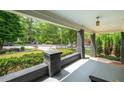 Spacious covered front porch perfect for relaxing and enjoying the neighborhood scenery at 416 2Nd Ave, Decatur, GA 30030