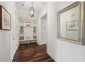 Convenient mudroom with built-in shelving, bench seating, and hardwood floors at 5695 Overlook Station Dr, Suwanee, GA 30024