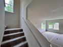 Bright entryway featuring a carpeted staircase and lots of natural light at 1964 Asher Ln # 47, Conyers, GA 30013