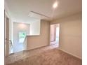 Upstairs hallway features carpet, a window and access to multiple rooms at 1964 Asher Ln # 47, Conyers, GA 30013