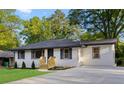 Exterior view of a home with fresh landscaping, new steps, and a freshly painted exterior at 2805 Long Way, Decatur, GA 30032