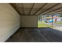 Spacious carport area providing covered parking and protection from the elements at 50 Ivy St, Porterdale, GA 30014