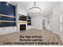 Open-concept living room with custom floating shelves and shiplap details at 5863 Landers Loop, Fairburn, GA 30213