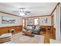 A living room with hardwood floors and wood-trimmed walls, and comfortable seating at 435 Trammell Dr, Alpharetta, GA 30009