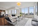 Bright living room with floor to ceiling windows and a beautiful city view at 1820 Peachtree Nw St # 1110, Atlanta, GA 30309