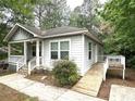 Well-maintained home exterior with a ramp and a neatly kept lawn at 2037 Lakewood Trl Se, Atlanta, GA 30315