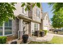 Beautiful home exterior featuring a gray brick facade, well-kept landscaping, and a welcoming front entrance at 3241 Alhambra Cir, Hampton, GA 30228
