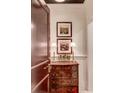 An elegant foyer featuring a chest of drawers with decorative lamps and framed artwork at 1717 N Decatur Ne Rd # 303, Atlanta, GA 30307