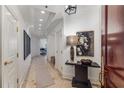 Bright hallway featuring elegant decor, recessed lighting, and marble floors, leading to living spaces at 3286 Northside Nw Pkwy # 903, Atlanta, GA 30327