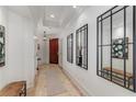 Bright hallway featuring elegant decor, recessed lighting, and marble floors, leading to living spaces at 3286 Northside Nw Pkwy # 903, Atlanta, GA 30327