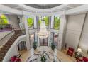 A grand lobby features a dazzling chandelier, marble floors, and an elegant staircase at 3286 Northside Nw Pkwy # 903, Atlanta, GA 30327