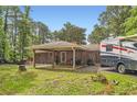 Charming home with a covered carport offering space for outdoor activities and adjacent RV parking at 263 Lynn Dr, Fayetteville, GA 30215