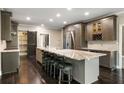 Spacious kitchen boasts a large island, stainless steel appliances, seating and custom cabinets at 2912 Dunhill Trl, Woodstock, GA 30189