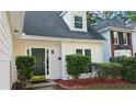 A stately home front door is surrounded by well-maintained landscaping at 3315 Haverhill Rowe, Lawrenceville, GA 30044