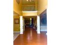 Stunning foyer with wood floors, soaring ceilings, and decorative columns at 7550 Star Magnolia, Lithonia, GA 30058