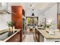 Modern kitchen featuring granite countertops, stainless steel appliances, and an island with a sink at 130 Arizona Ne Ave # 104, Atlanta, GA 30307