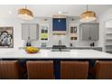 Stylish kitchen features a large island, stainless steel appliances, and custom cabinetry at 2032 Spink Nw St, Atlanta, GA 30318