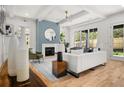 Bright living room features a fireplace, modern furnishings, and an open layout with ample natural light at 2032 Spink Nw St, Atlanta, GA 30318