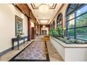 Bright hallway with large windows, fountain, and decorative plants at 3334 Peachtree Ne Rd # 608, Atlanta, GA 30326