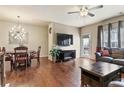 Open living area with hardwood floors, a modern light fixture, and access to the outdoor patio at 4181 Integrity Way, Powder Springs, GA 30127