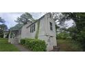 This shows the home exterior, highlighting the side profile and landscaping at 1516 Carter Rd, Decatur, GA 30032