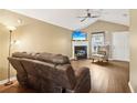 Inviting living room with a fireplace, hardwood floors, and a cozy seating area at 220 Turnstone Rd, Stockbridge, GA 30281