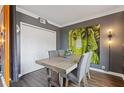 The dining room features modern lighting, luxury flooring and eye catching art at 3481 Lakeside #901 Ne Dr, Atlanta, GA 30326