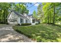 Well-maintained home with a two-car garage, tidy landscaping, and a paved driveway at 4112 Willow Sw Walk, Lilburn, GA 30047