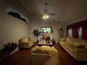 Inviting living room featuring hardwood floors, vaulted ceiling, and a cozy fireplace at 3393 Chancellors Dr, Powder Springs, GA 30127