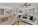 Bright living room featuring modern furniture, a ceiling fan, and large windows at 874 Welch St, Atlanta, GA 30310