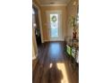 Inviting entryway with hard wood flooring and a decorative glass door at 2860 Camelot Woods Dr, Lawrenceville, GA 30044