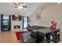 Inviting living room with a cozy fireplace, vaulted ceilings and a plush area rug at 3130 Jorden Crest Ct, Lawrenceville, GA 30044