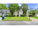 Charming two-story home features a lush lawn, mature trees, and a well-maintained exterior at 76 Burbank Dr, Atlanta, GA 30314