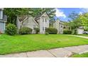 Well-manicured lawn of the home with lush green grass and mature shrubs and trees at 76 Burbank Dr, Atlanta, GA 30314